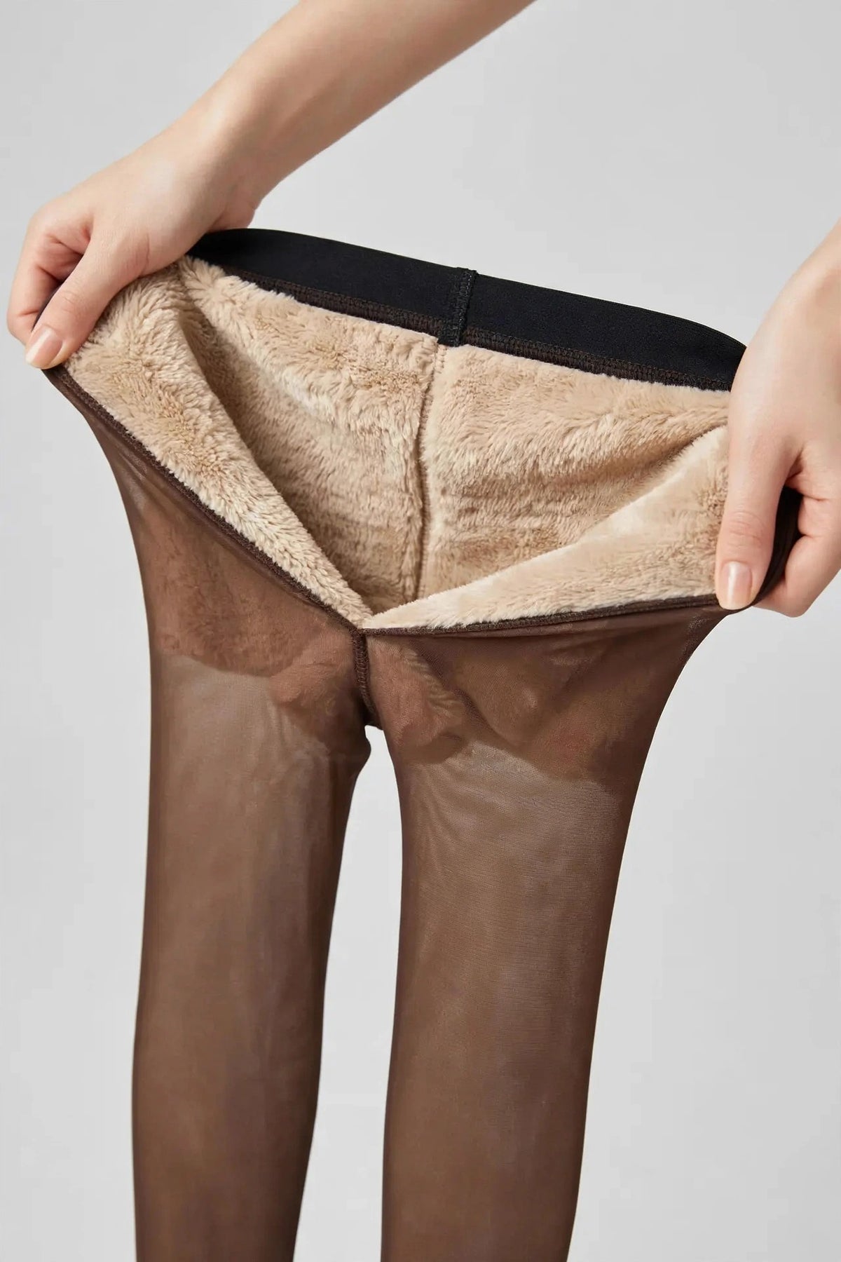 Coffee fleece-lined tights with a sheer look, shown with the beige fleece lining folded out.